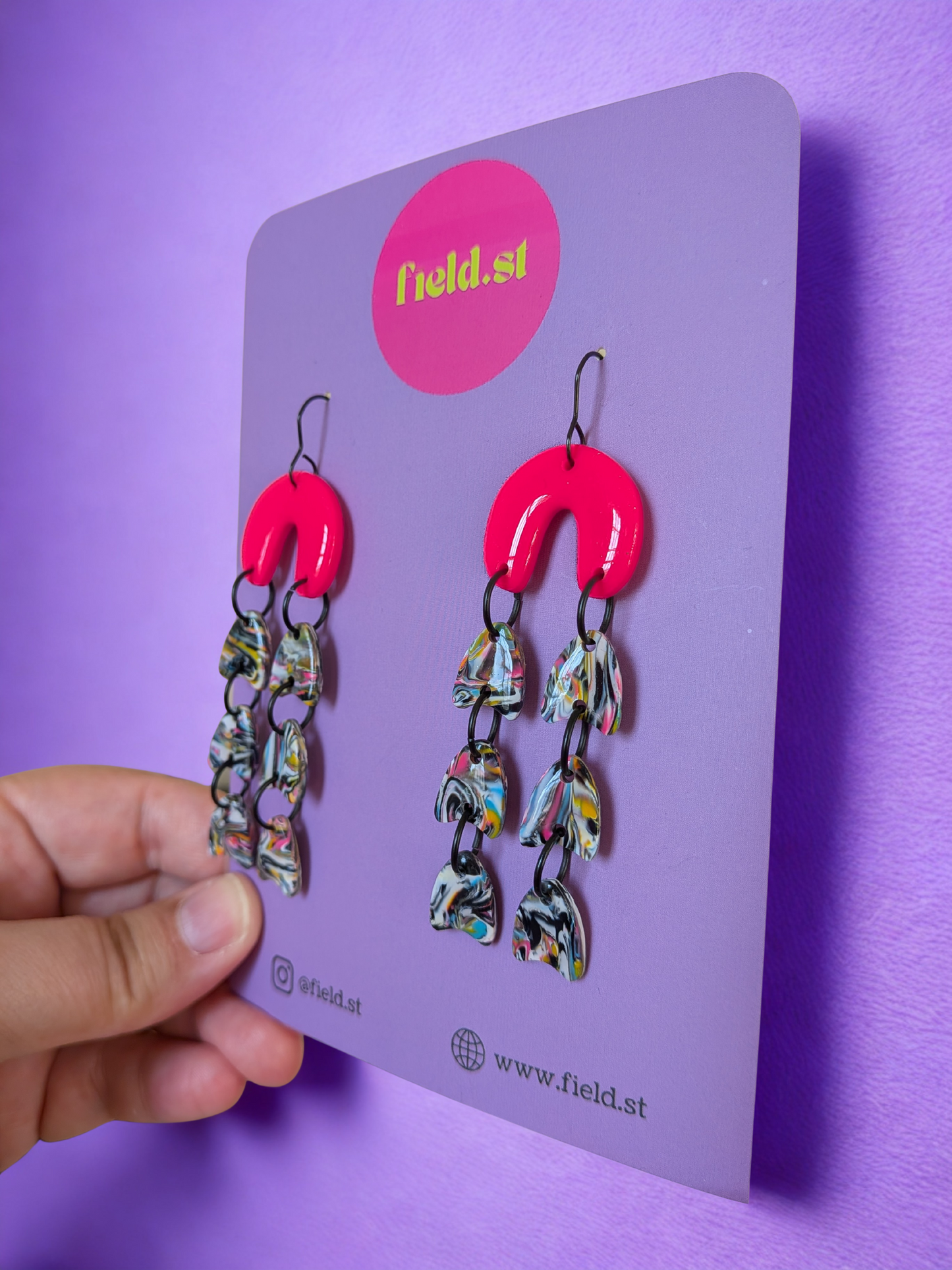 Neon pink patterned dangle arches