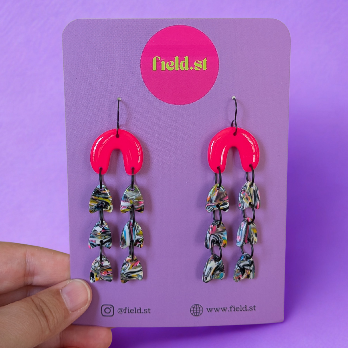 Neon pink patterned dangle arches